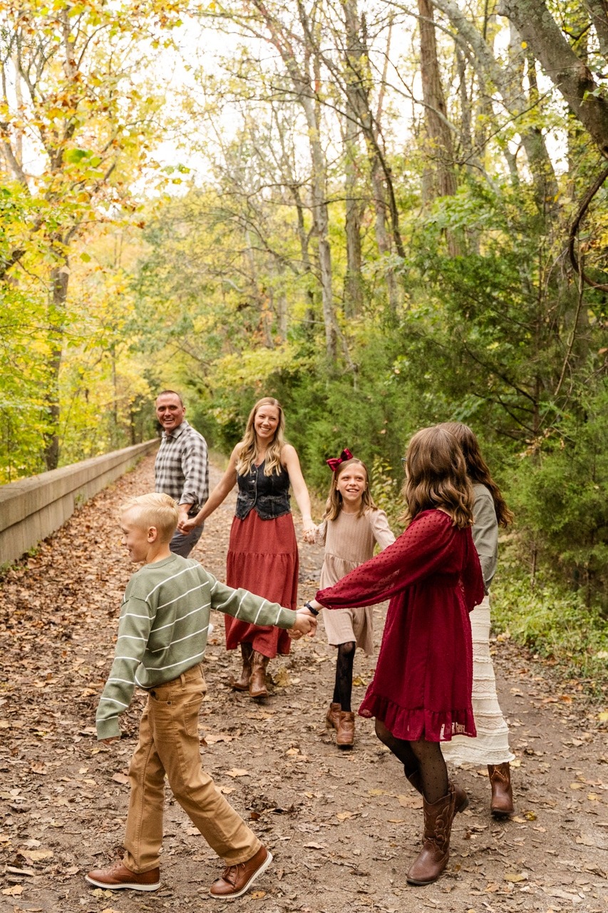 Family Walking in a line, holding hands